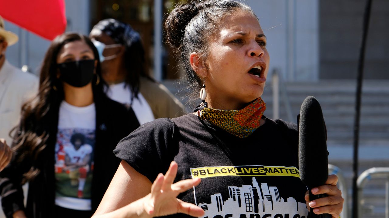 In this Aug. 5, 2020 file photo, Melina Abdullah speaks during a Black Lives Matter protest at the Hall of Justice in downtown Los Angeles. (AP Photo/Richard Vogel, File)