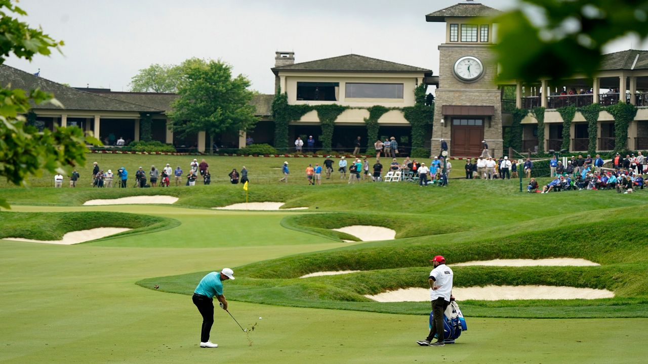 Bo Hoag hits to the 18th green during the first round of the Memorial golf tournament, Thursday, June 3, 2021, in Dublin, Ohio. (AP Photo/Darron Cummings)