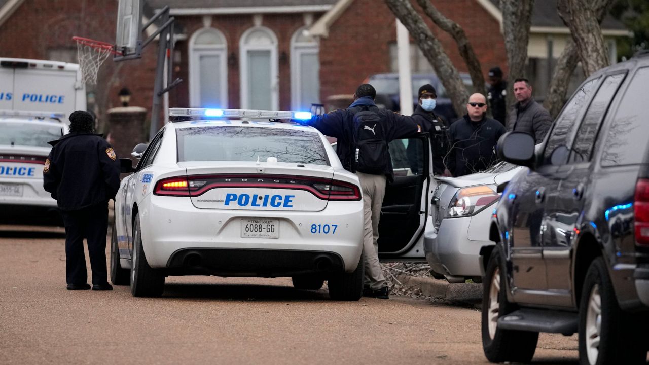 Members of the Memphis Police Department work a crime scene Tuesday. (AP Photo/Gerald Herbert)