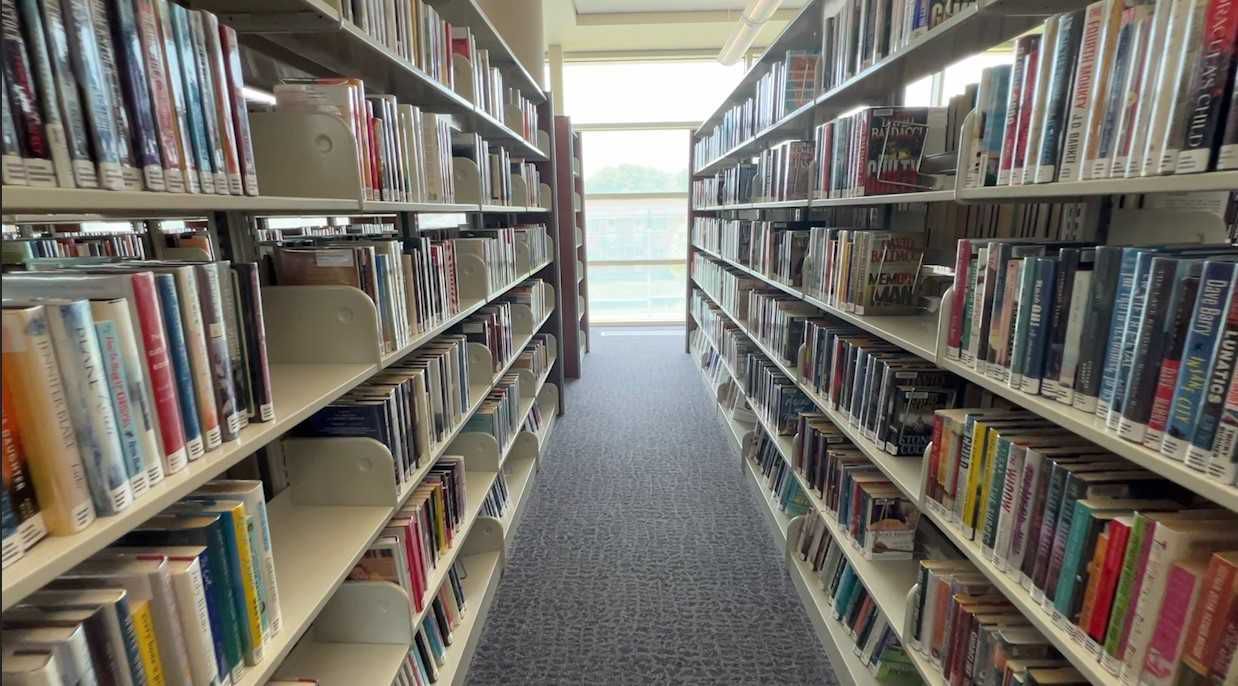 Library shelves in Menomonee, WI. (Spectrum News)