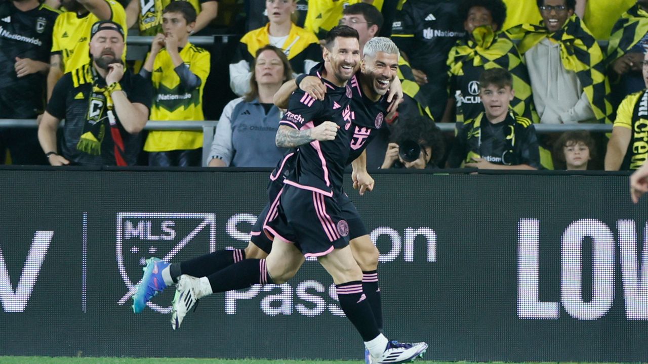 Inter Miami's Lionel Messi, left, and Luis Suarez celebrate their goal against the Columbus Crew during the second half of an MLS soccer match, Wednesday, Oct. 2, 2024, in Columbus, Ohio. (AP Photo/Jay LaPrete)