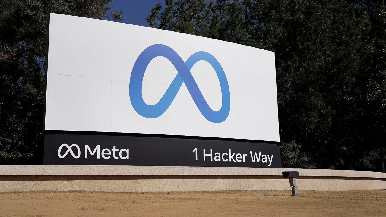 Meta's logo sign is seen at the company headquarters in Menlo Park, Calif. (AP Photo/Tony Avelar, File)