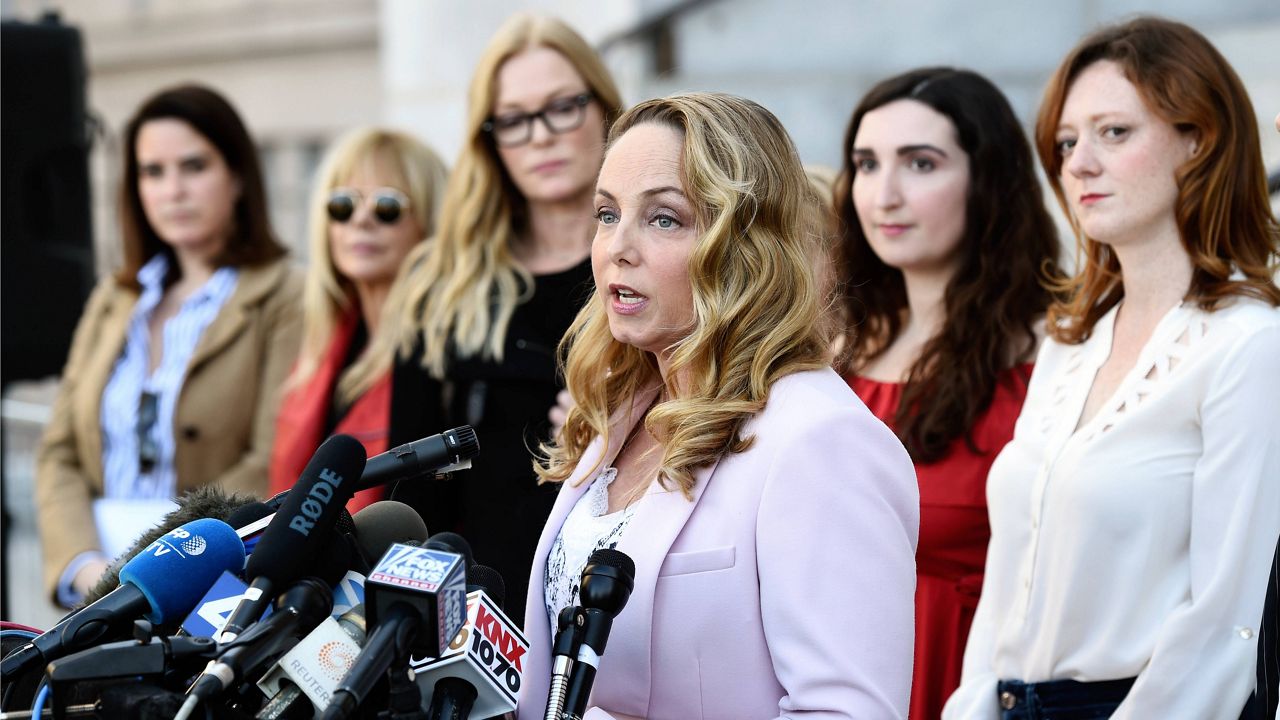 Actress Louisette Geiss speaks at a news conference by the "Silence Breakers," a group of women who have spoken out about Hollywood producer Harvey Weinstein's sexual misconduct, at Los Angeles City Hall, on Feb. 25, 2020, in Los Angeles. Geiss, a former actress and screenwriter who accused Weinstein in 2017, has written a musical stemming from her experiences with Weinstein. “The Right Girl,” which was waylaid by the pandemic but will be produced live onstage sometime in 2023. (AP Photo/Chris Pizzello)