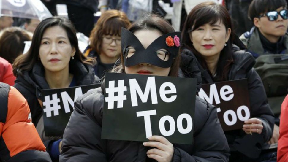 Female workers supporting the MeToo movement wearing black attend a rally to mark the International Women’s Day in Seoul, South Korea, Thursday, March 8, 2018. (AP Photo/Ahn Young-joon)