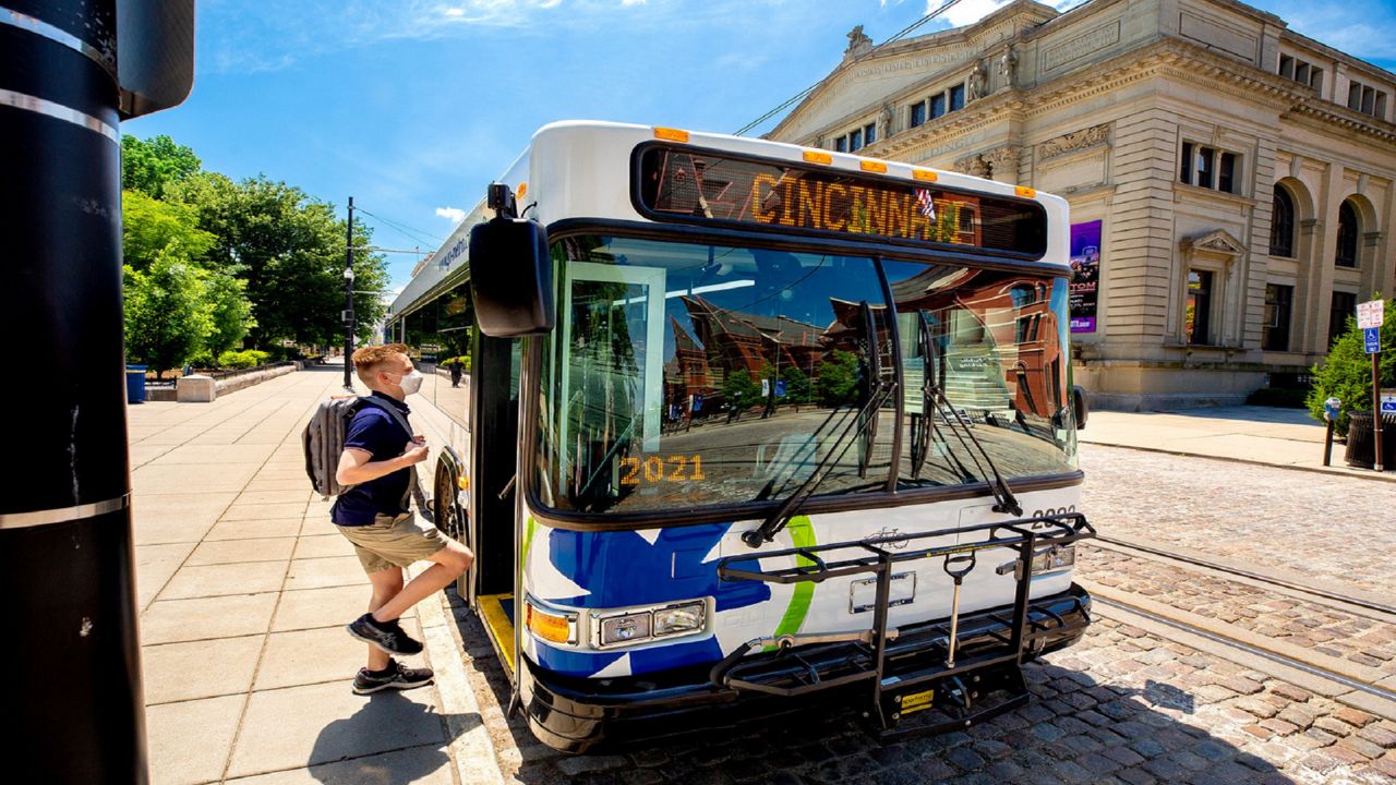 A young person boards a Cincinnati Metro bus. (Provided)