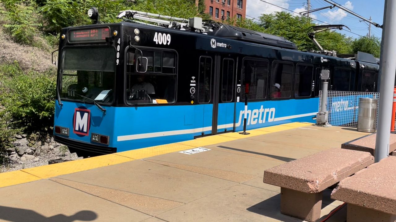 A MetroLink Blue Line train comes through the Forest Park-DeBaliviere Station.