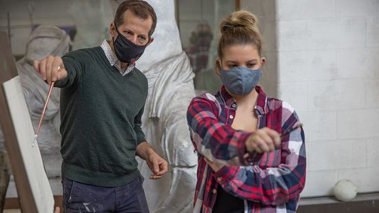 An instructor at Miami University teaches a student during class (Provided: Miami University)