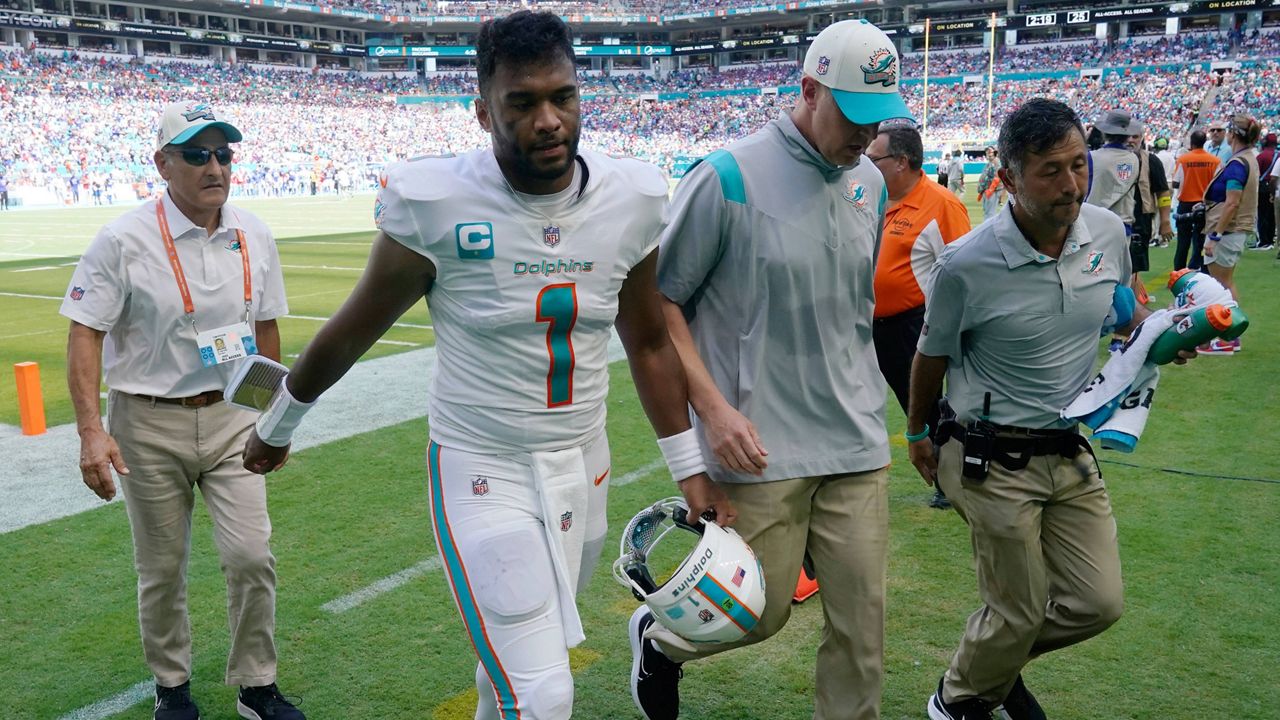 Hawaii native Tua Tagovailoa walked off before halftime with an apparent head injury but returned to help lead Miami to a 21-19 win over the Buffalo Bills on Sunday.