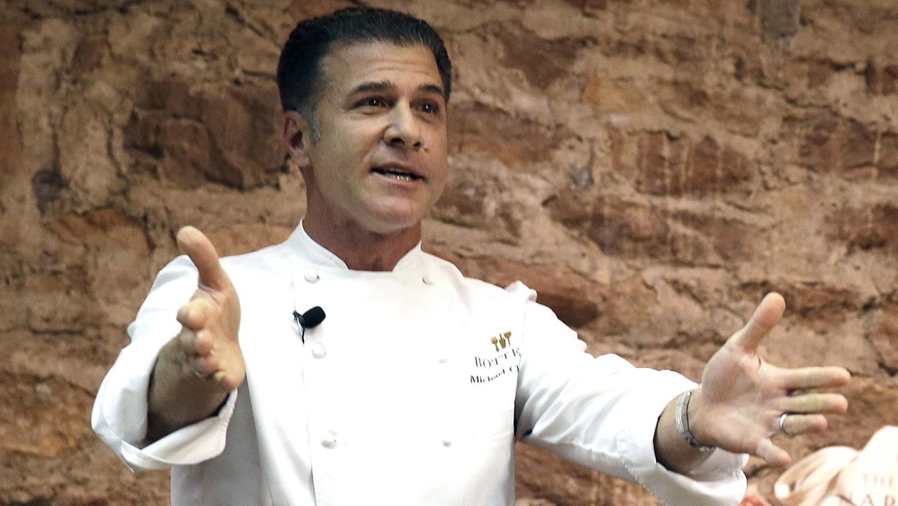 Chef Michael Chiarello appears before the start of an East meets West cooking battle in St. Helena, Calif., on Nov. 23, 2013. (AP Photo/Eric Risberg, File)