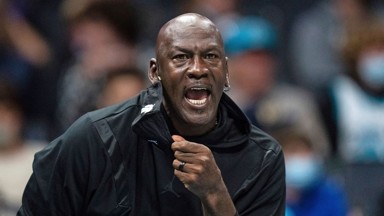 Michael Jordan looks on during an NBA basketball game between the Charlotte Hornets and the New York Knicks in Charlotte, N.C., on Friday, Nov. 12, 2021. (AP file photo/Jacob Kupferman)