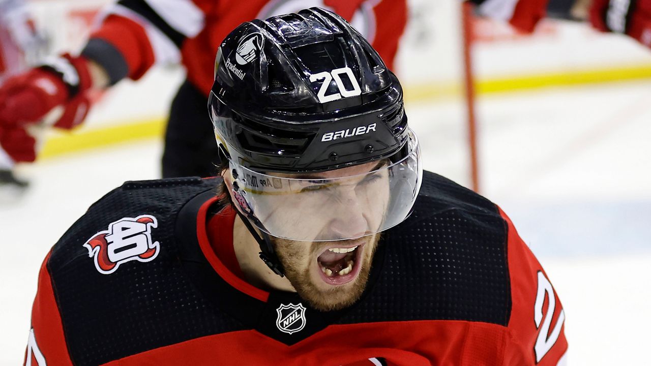 New Jersey Devils defensemen Dougie Hamilton, left, and Jonas