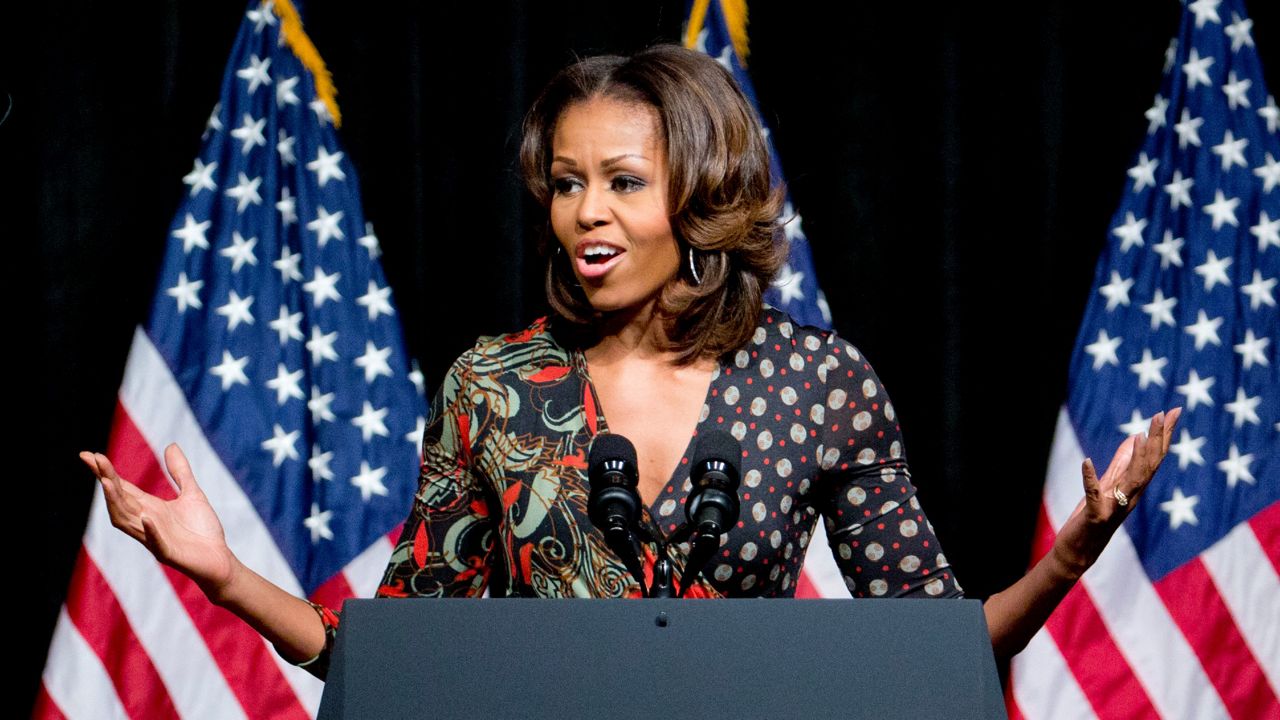 Former first lady Michelle Obama speaks to students about committing to education to create a better future for themselves and their country, Tuesday, Nov. 11, 2013, at Bell Multicultural High School in Washington. (AP Photo/Carolyn Kaster)