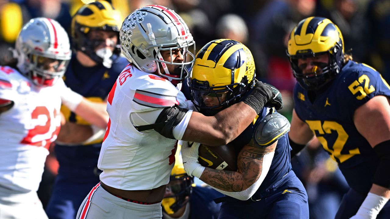 Michigan running back Blake Corum is tackled by Ohio State safety Sonny Styles at the goal line during the first half of an NCAA college football game, Saturday, Nov. 25, 2023, in Ann Arbor, Mich. Michigan won 30-24. (AP Photo/David Dermer)