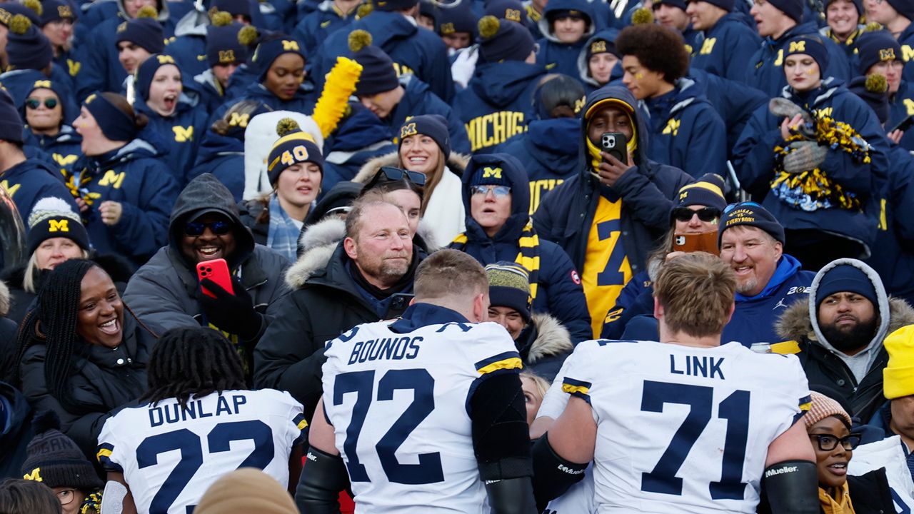 Michigan players celebrate their win over Ohio State in an NCAA college football game Saturday, Nov. 30, 2024, in Columbus, Ohio. (AP Photo/Jay LaPrete)