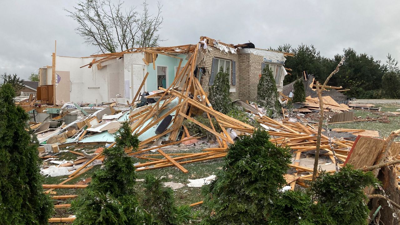 Damage is seen at a home after a tornado came through the area in Gaylord, Mich., Friday, May 20, 2022. (AP Photo/John Flesher)