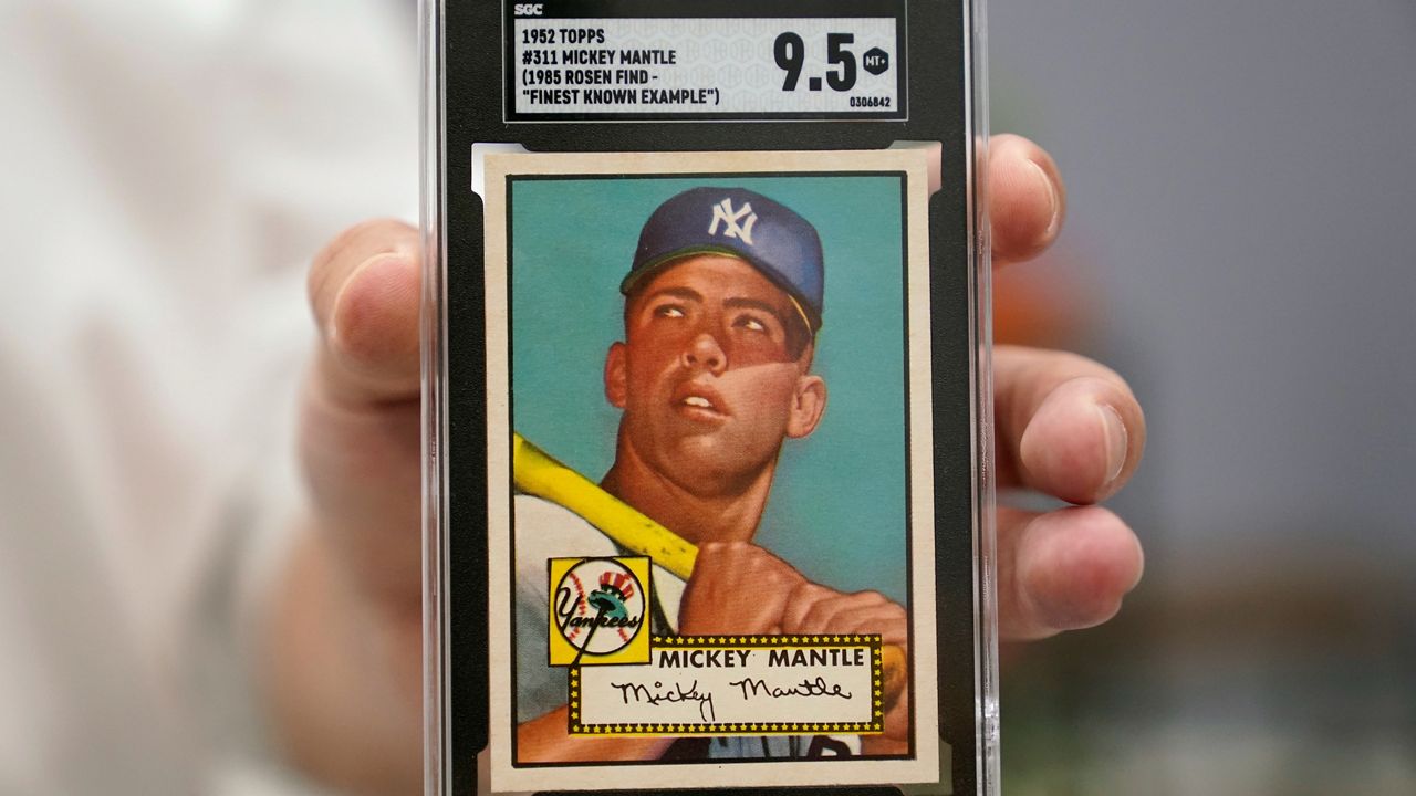 A Mickey Mantle baseball card is pictured.