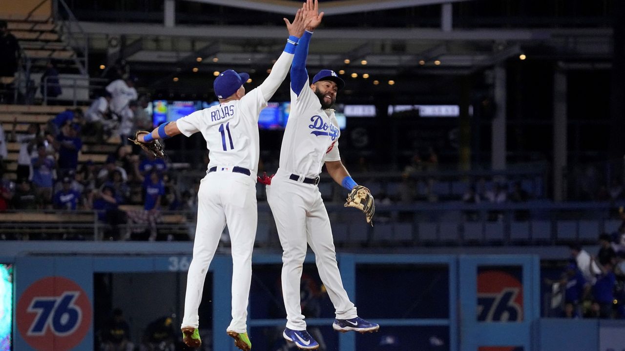 Los Angeles Dodgers' David Peralta (6) celebrates after doubling