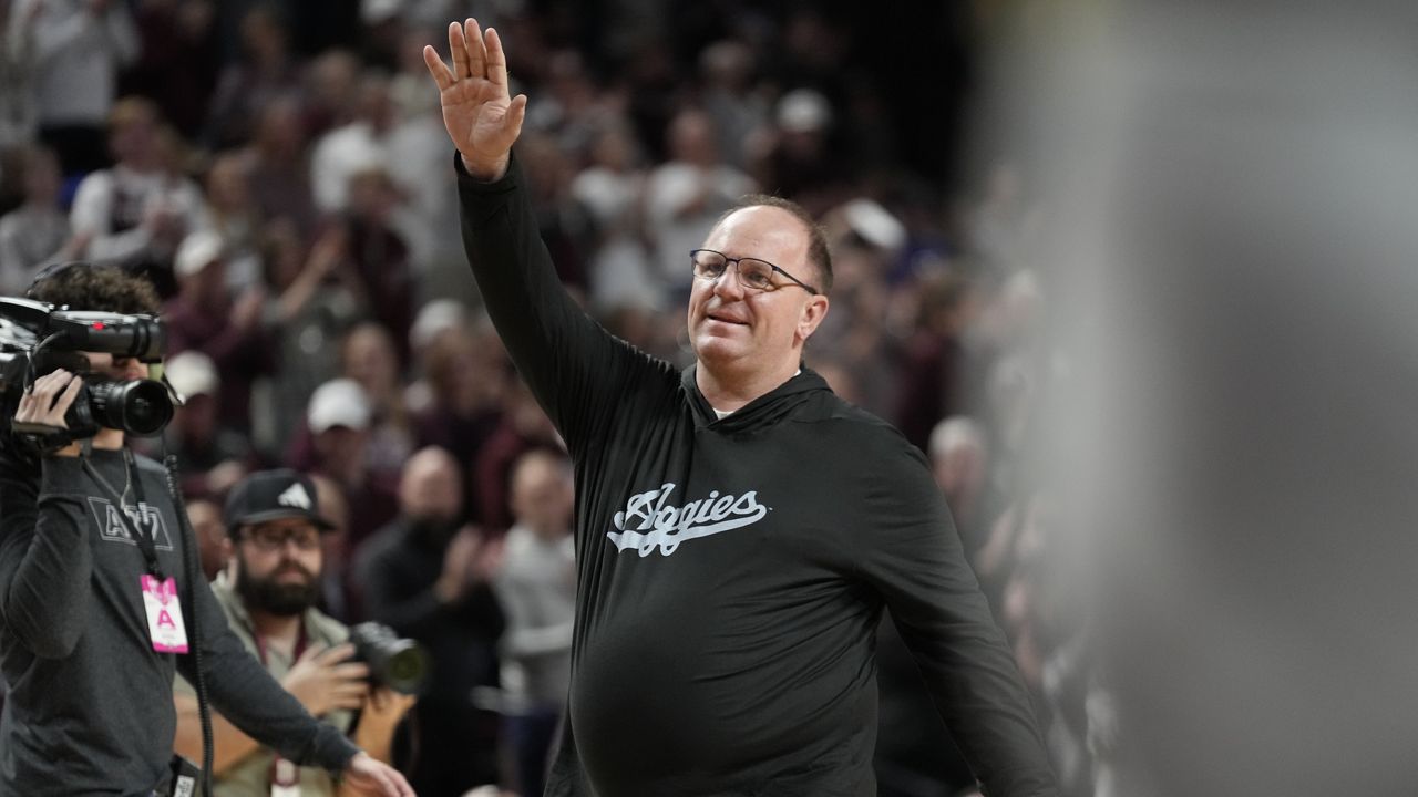 Texas A&M head football coach Mike Elko waves to the crowd at Reed arena during an NCAA college basketball game between Texas A&M and Kentucky on Saturday, Jan. 13, 2024, in College Station, Texas. (AP Photo/Sam Craft, File)