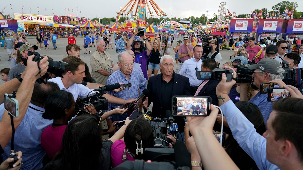 Former Vice President Mike Pence speaks to the media during a visit to the Iowa State Fair, Friday, Aug. 19, 2022, in Des Moines, Iowa. Potential White House hopefuls from both parties often swing by Iowa's legendary state fair during a midterm election year to connect with voters who could sway the nomination process. But this year, the traffic at the fair was noticeably light. Democrats are uncertain about President Joe Biden's political future and many Republicans avoid taking on former President Donald Trump. (AP Photo/Charlie Neibergall)