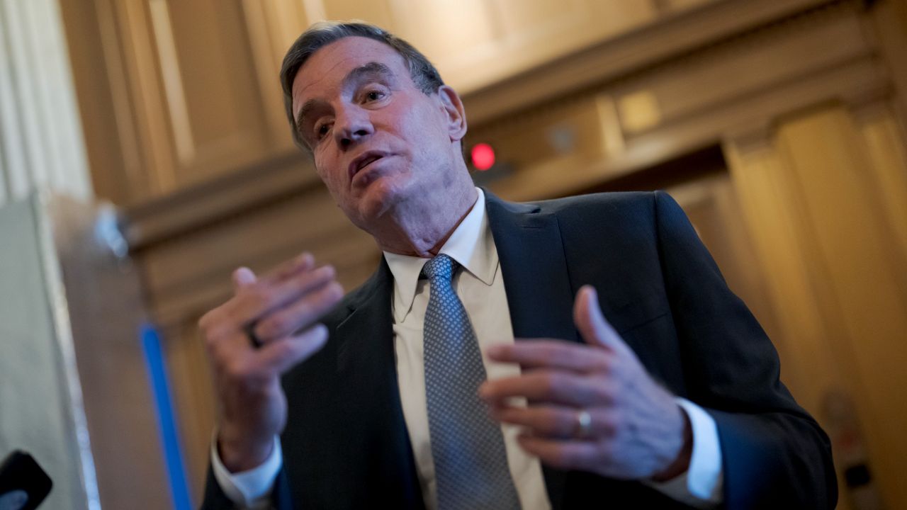 Sen. Mark Warner, D-Va., chair of the Senate Intelligence Committee, pauses to speak with reporters at the Capitol in Washington, Nov. 10, 2022. (AP Photo/J. Scott Applewhite, File)