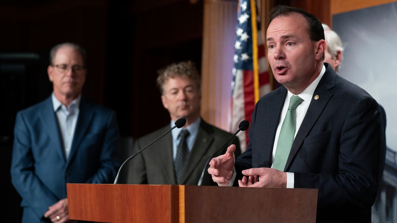 Sen. Mike Lee, R-Utah, from right, with Sens. Rand Paul, R-Ky., Mike Braun, R-Ind., talks about debt ceiling during a news conference on Capitol Hill in Washington, Wednesday, Jan. 25, 2023. (AP Photo/Manuel Balce Ceneta)