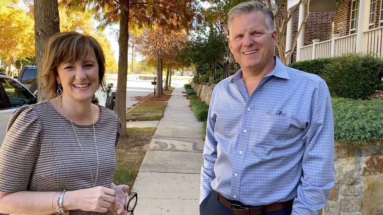 DFW realtors Andrea and Tad Miller appear in this image from November 2020. (Lupe Zapata/Spectrum News 1)