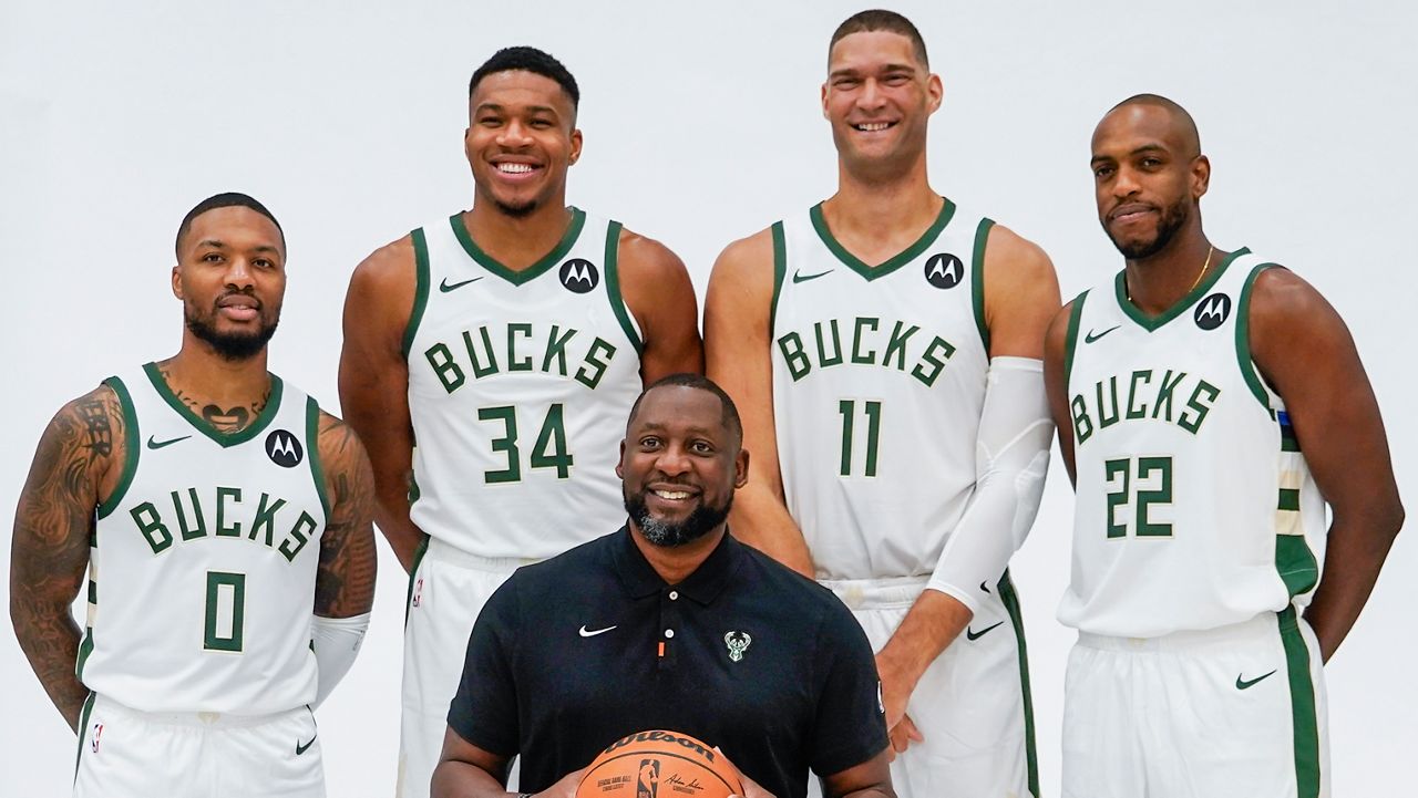 Milwaukee Bucks' Giannis Antetokounmpo, Damian Lillard, Brook Lopez, Khris Middleton and head coach Adrian Griffin pose for a picture