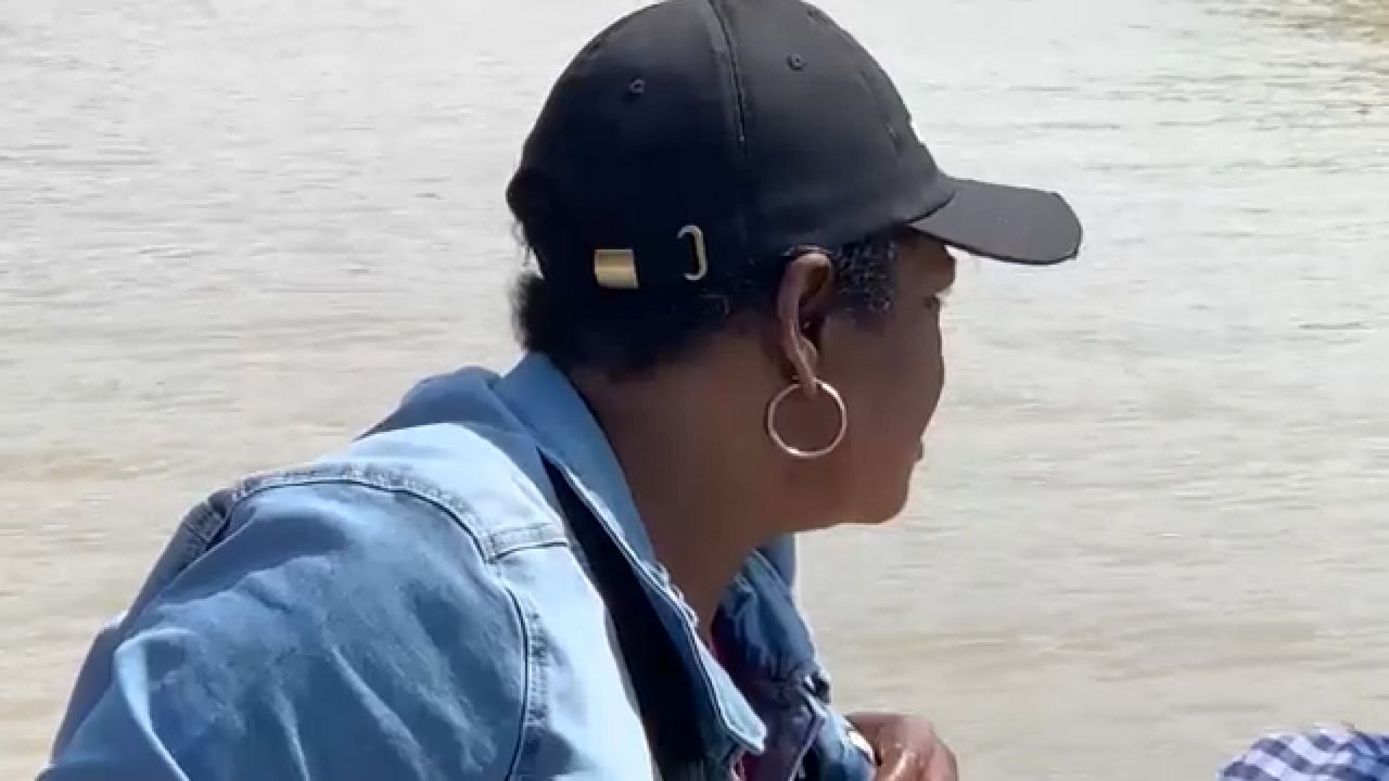 Latoraya Brian searches for her grandson's body in the Genesee River in Rochester