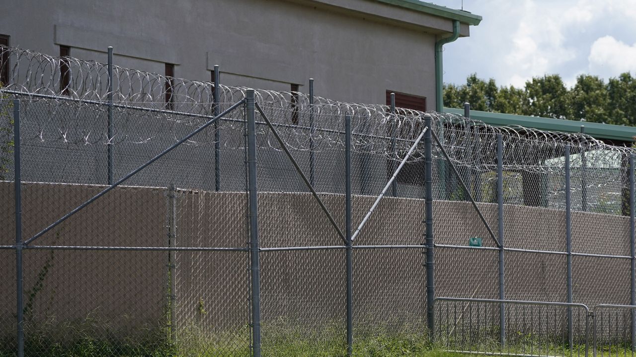 Rolls of razor wire line the top of the security fencing at the Raymond Detention Center in Raymond, Miss., on Aug. 1, 2022. (AP Photo/Rogelio V. Solis, File)