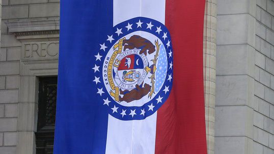 Governor-elect Eric Greitens and his wife wave from the steps of the capitol before his swearing in as governor of Missouri in Jefferson City, Mo., Monday, Jan. 9, 2017. (AP Photo/Orlin Wagner)