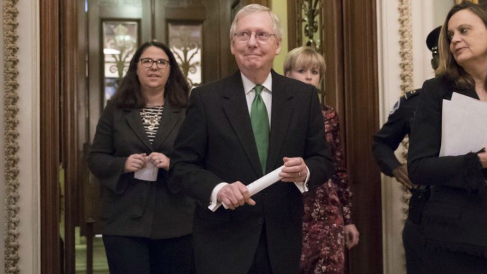 Senate majority leader Mitch McConnell, R-Ky, leaves the chamber after announcing an agreement in the Senate on a two year almost $400 billion budget deal that would provide Pentagon and domestic programs with huge spending increases. (AP Photo/J. Scott Applewhite)