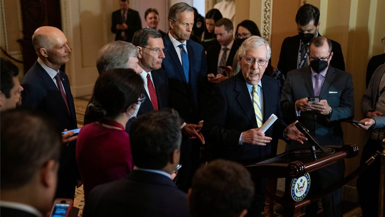 Senate Minority Leader Mitch McConnell talks with reporters after a policy luncheon Tuesday at the Capitol. (AP Photo/Evan Vucci)