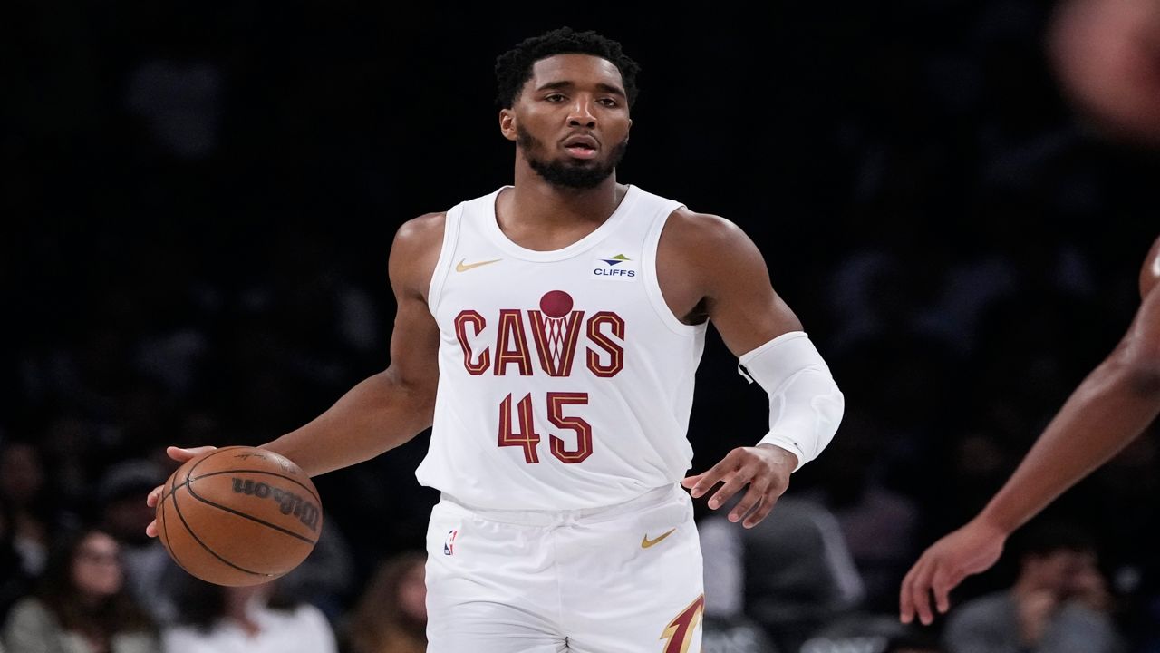 Cleveland Cavaliers' Donovan Mitchell looks to pass during the first half of an NBA basketball game against the Brooklyn Nets, Wednesday, Oct. 25, 2023, in New York. (AP Photo/Frank Franklin II)