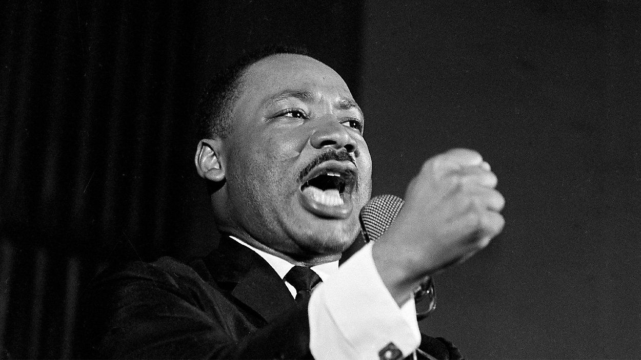 Dr. Martin Luther King Jr. shakes his fist during a speech in Selma, Ala., Feb. 12, 1965. (AP Photo/Horace Cort)