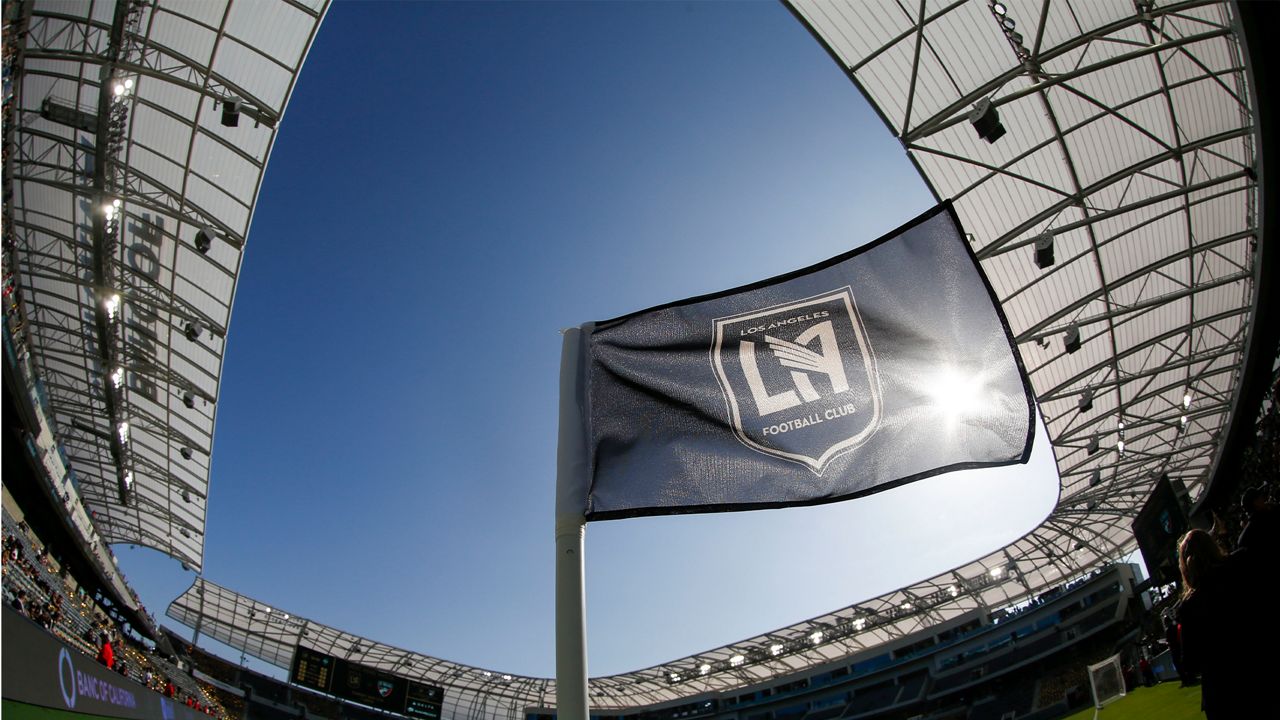 In this April 29, 2018 file photo taken with a fisheye lens, a flag flies at the Banc of California Stadium prior to an MLS soccer game between Los Angeles FC and the Seattle Sounders in Los Angeles. Los Angeles FC will seek a new name for its 2-year-old Banc of California Stadium after a restructuring of the bank's partnership with the Major League Soccer club. (AP Photo/Ringo H.W. Chiu, file)