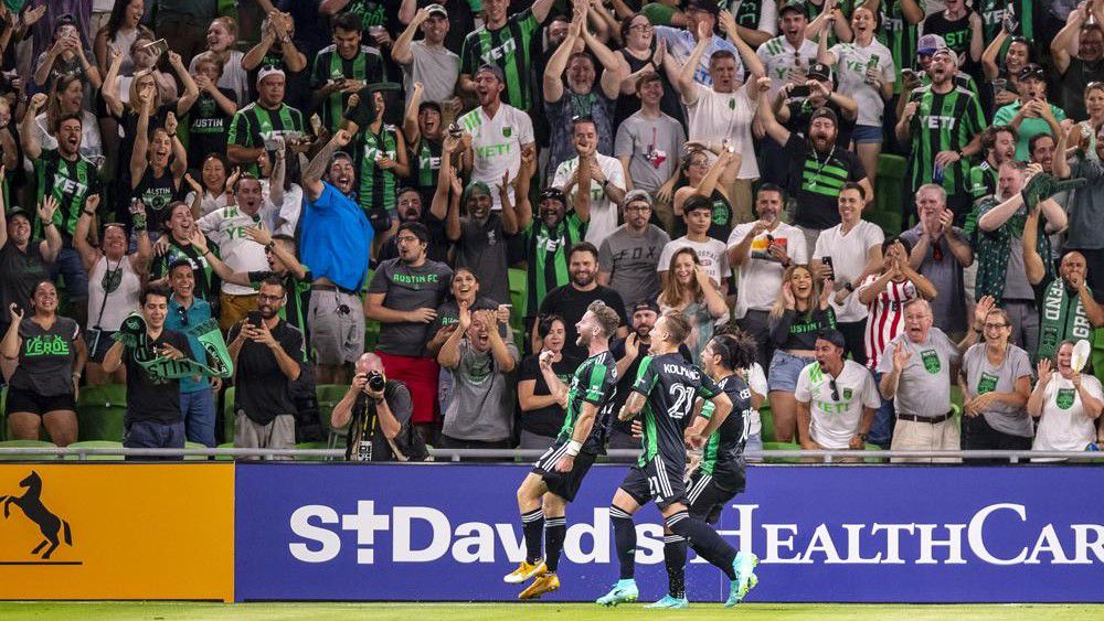 Austin FC forward Jon Gallagher, left, celebrates with his teammates after scoring against the Portland Timbers during the first half of an MLS soccer match Thursday, July 1, 2021, in Austin, Texas. (Ricardo B. Brazziell/Austin American-Statesman via AP)