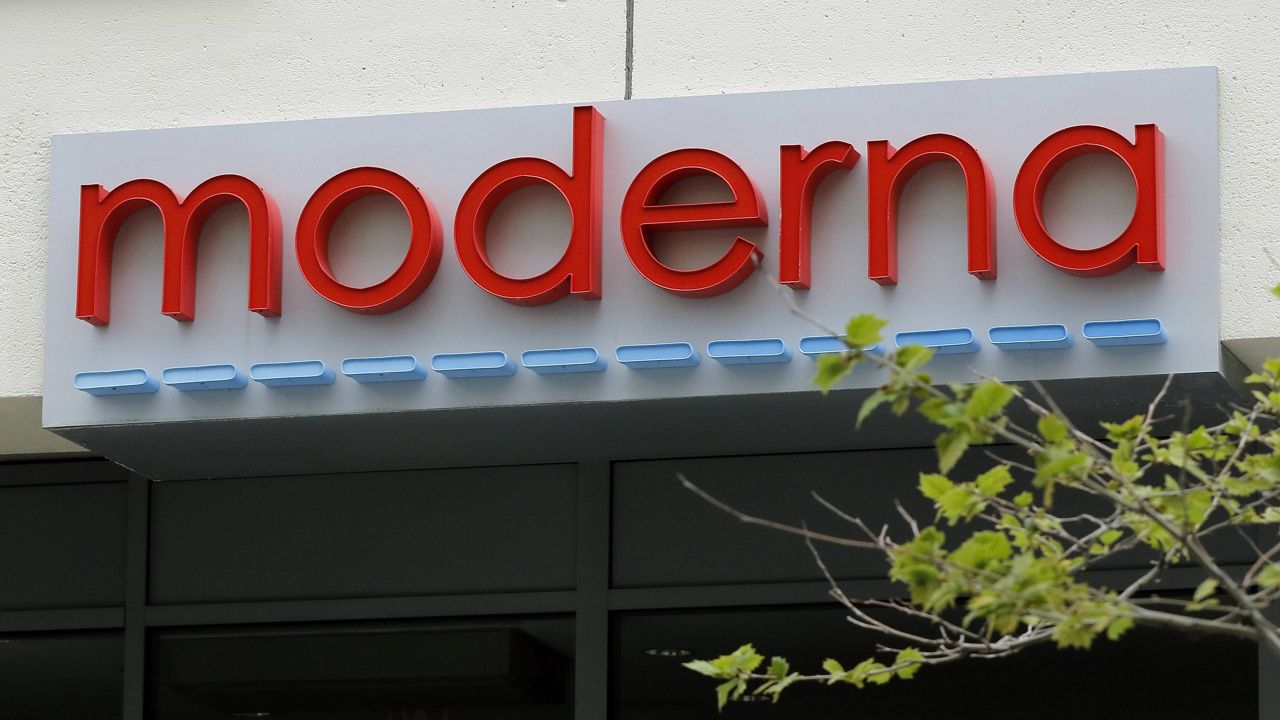A sign marks an entrance to a Moderna building in Cambridge, Mass. (AP Photo/Bill Sikes, File)
