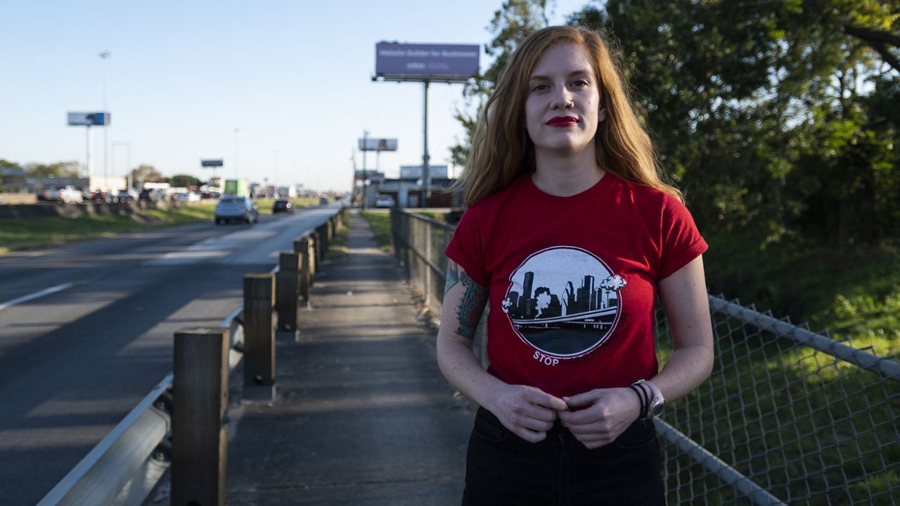 Molly Cook, an organizer with Stop TxDOT I-45, on the Interstate 45 frontage road on Nov. 19, 2021, in Houston. Federal authorities announced Tuesday, March 7, 2023, they have lifted their hold of a more than $9 billion Houston area highway-widening project that has come under intense criticism from residents and activists who have argued the proposal would cause lasting economic and environmental damage to their communities. (AP Photo/Justin Rex, File)