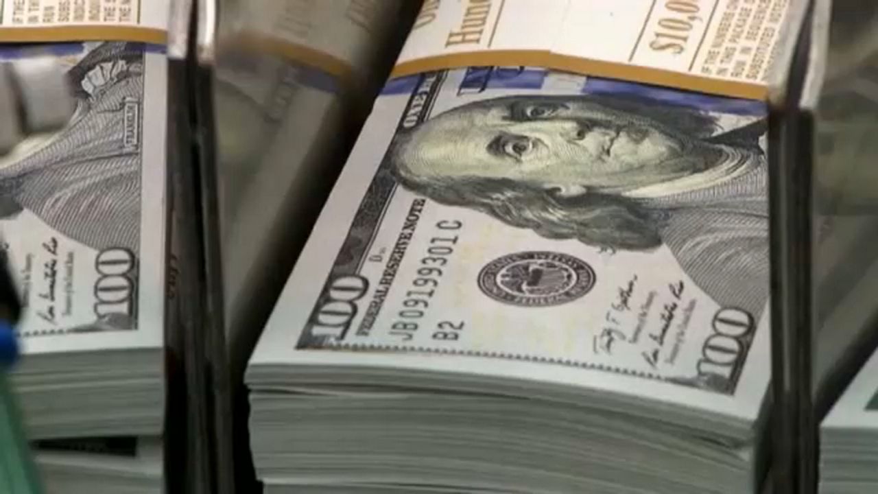 Stacks of cash appear in this file image. (Spectrum News 1/FILE)