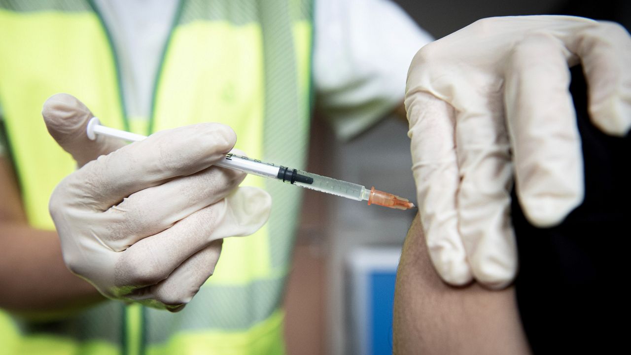 A man receives a vaccine against Monkeypox in Paris on Wednesday. (Alain Jocard, Pool via AP)