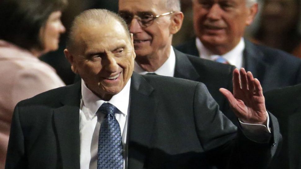 In this April 2, 2016, file photo, President Thomas S. Monson, of The Church of Jesus Christ of Latter-day Saints, raises his hand during a sustaining vote at the two-day Mormon church conference, in Salt Lake City. Monson, the 16th president of the Mormon church, had died after nine years in office. He was 90. (AP Photo/Rick Bowmer, File)