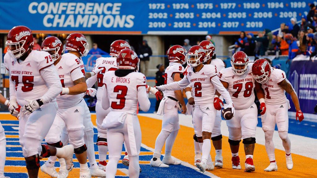 Fresno State celebrated a touchdown at Boise State en route to the Mountain West football championship on Saturday.
