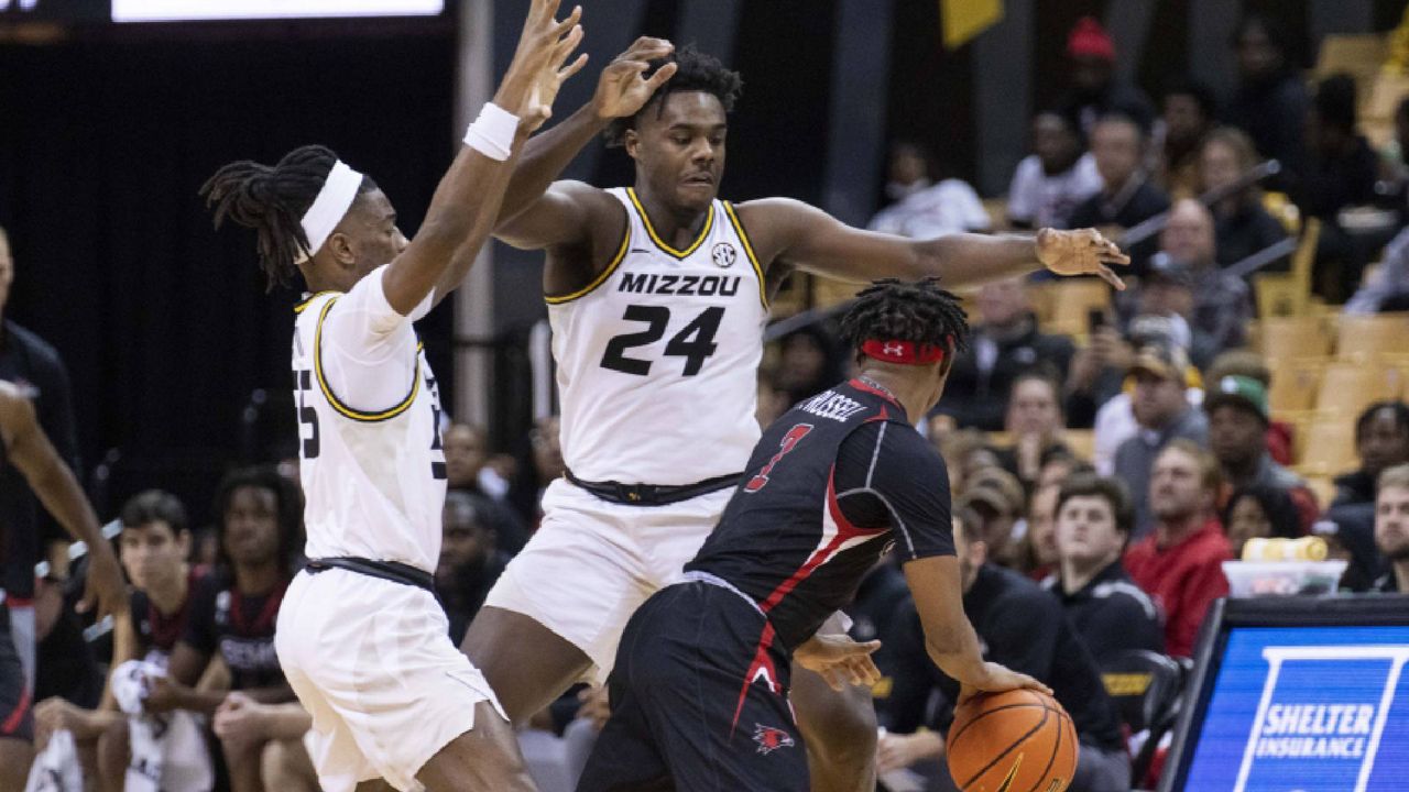 Missouri's Sean East II, left, and Kobe Brown, center, pressure Southeast Missouri State's Phillip Russell, right, during the second half of an NCAA college basketball game Sunday, Dec. 4, 2022, in Columbia, Mo. Both teams have qualified for the NCAA tournament (AP Photo/L.G. Patterson)