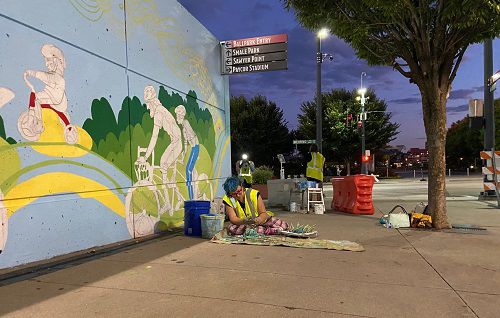 Youth apprentice Phoenix Brumm-Jost, 17, works on a section of the mural. (Photo courtesy of Lora Jost)
