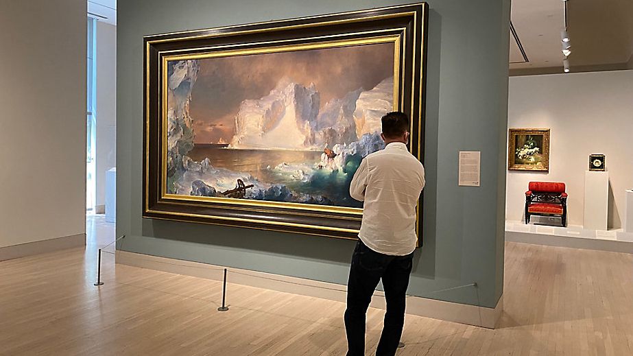 A visitor at the Dallas Museum of Art admires Fredric Edwin Church’s The Icebergs on Friday. The art museum is one of several reopening in Dallas this weekend after being closed for 5 months for the pandemic. (Photos by Sabra Ayres/Spectrum News)