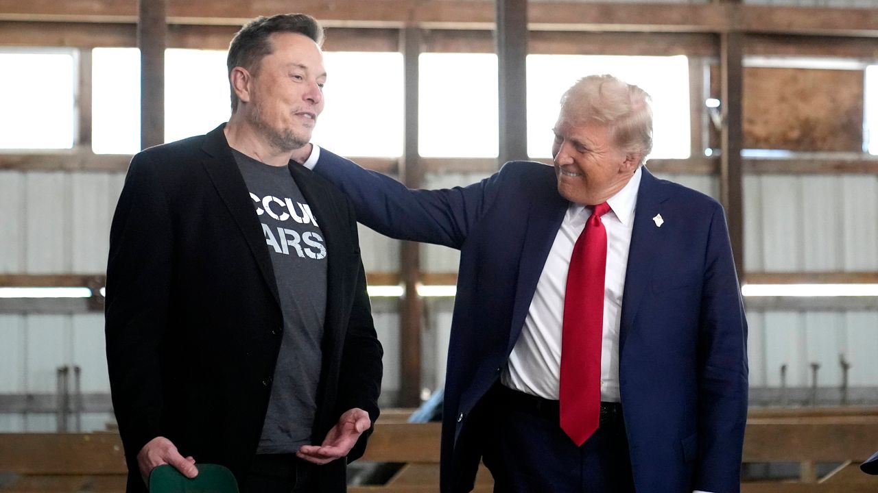 Elon Musk, left, and then-Republican presidential nominee Donald Trump attend a campaign event at the Butler Farm Show, Saturday, Oct. 5, 2024, in Butler, Pa. (AP Photo/Alex Brandon, File)