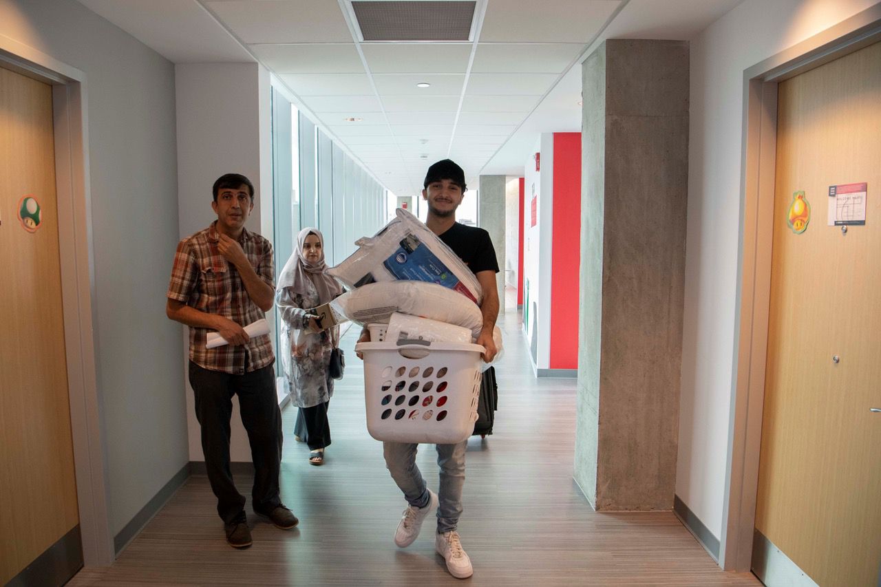 Muslim Khzir, Gilbert A Dater High School, moves personal items into his dorm inside Marian Spencer Hall. (Photo courtesy of University of Cincinnati)