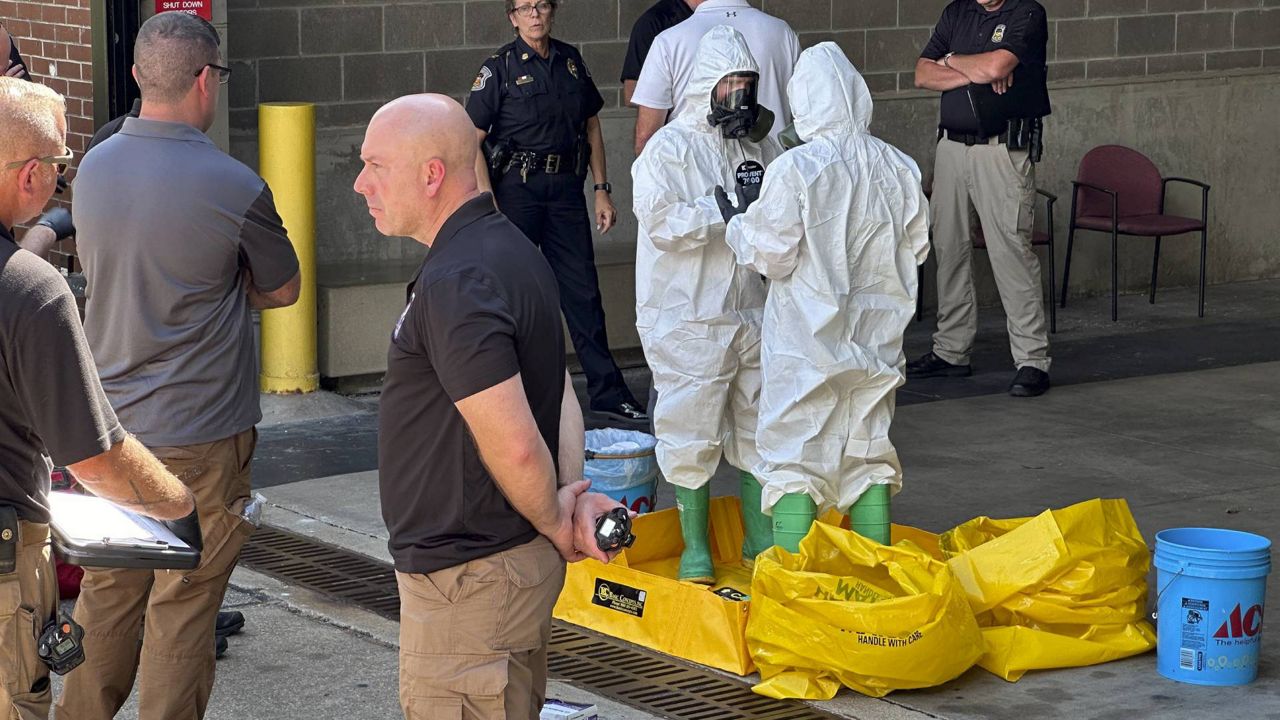 A hazmat crew from the National Guard's Civilian Support Team investigates after a suspicious package was delivered to election officials at the Missouri Secretary of State's Jefferson City, Mo., office on Tuesday Sept. 17, 2024. (AP Photo/Summer Ballentine)