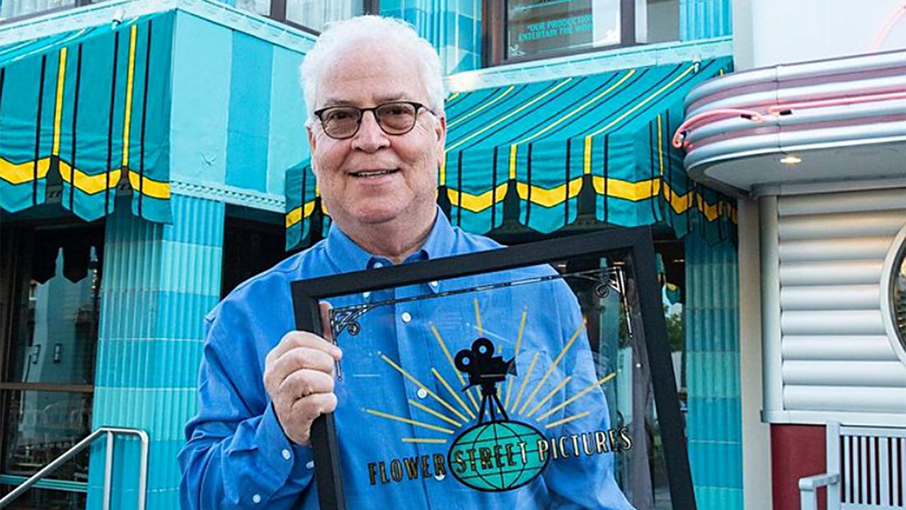 Former Walt Disney Imagineering president Bob Weis with his honorary window at Disney's Hollywood Studios. (Photo: Walt Disney Imagineering/Instagram)