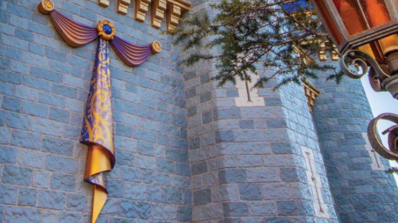 The first piece of decoration for Disney World's 50th anniversary celebration has been added to Cinderella Castle. (Courtesy of Disney)